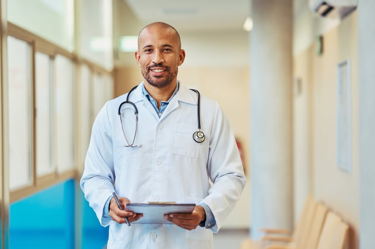 Portrait of a smiling doctor holding a clipboard