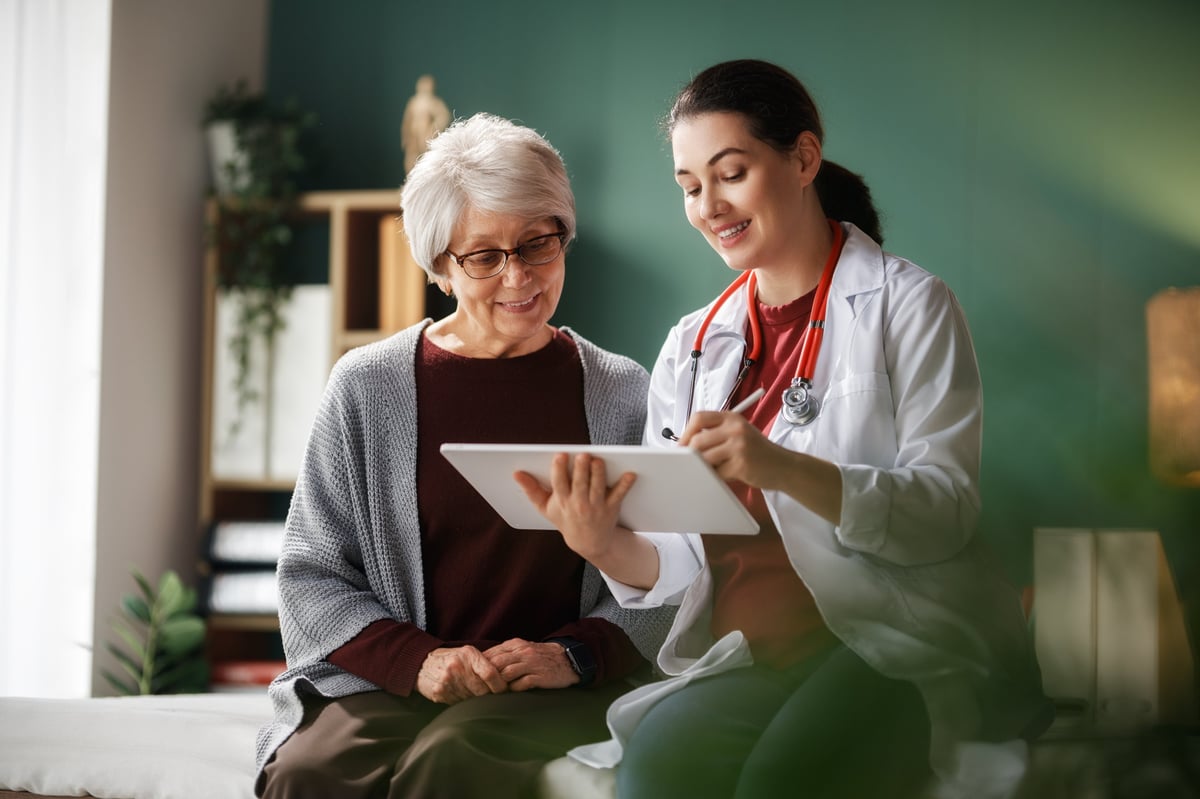 Female patient listening to a doctor in hospital